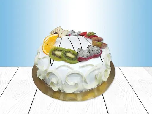 Birthday Cake with Cream and Fresh Fruit