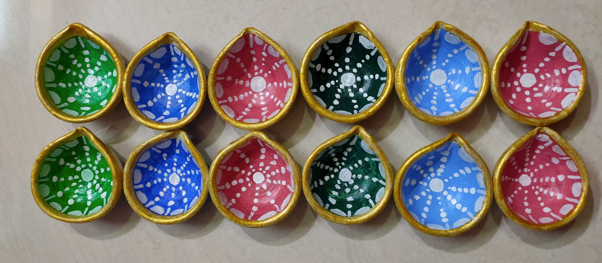 12 Colourful Diyas.