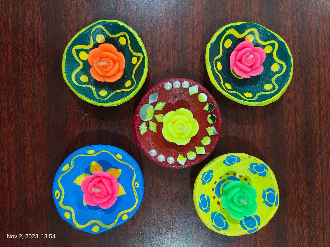 Designed diya with floating Candle