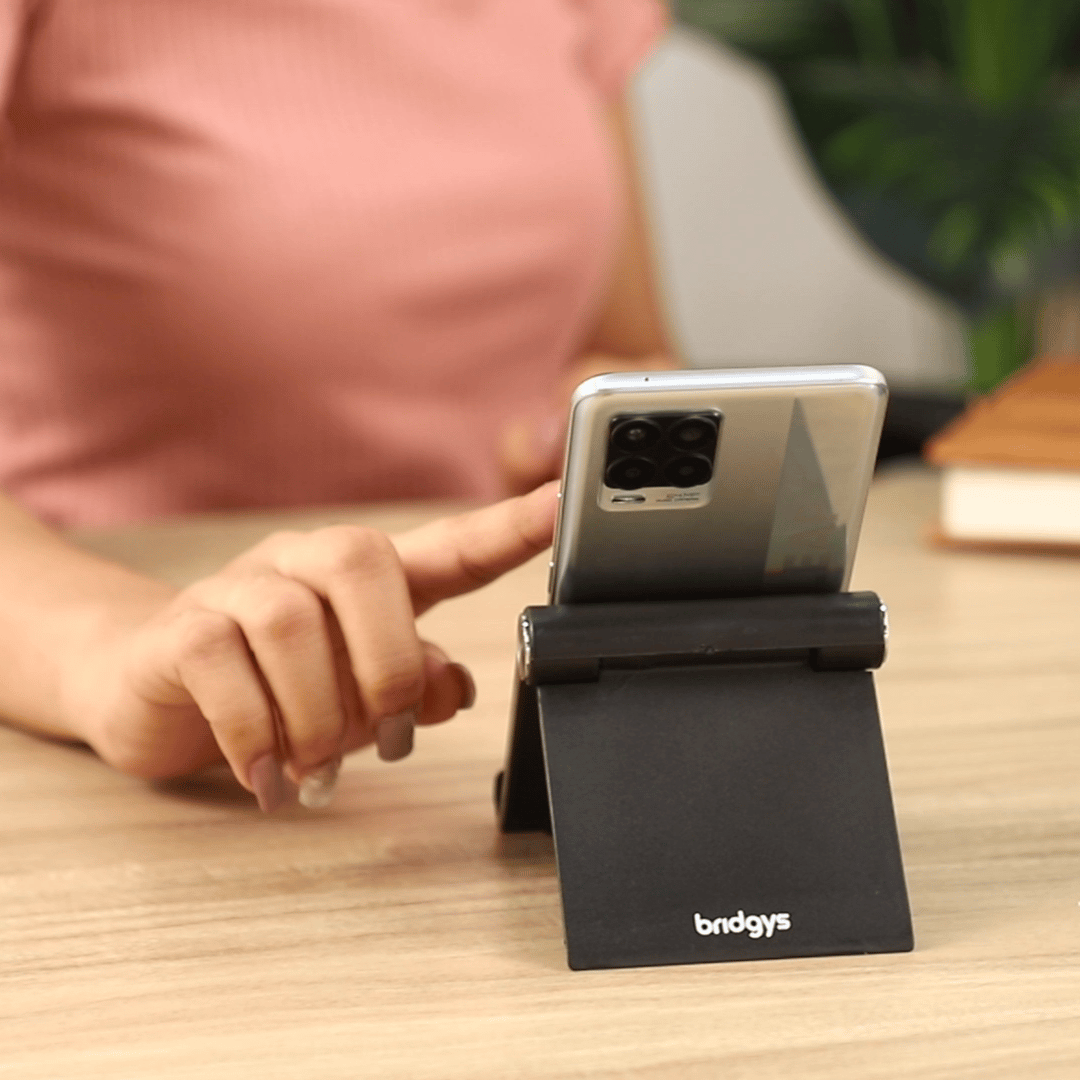 Bridgys Adjustable Tablet/Mobile Phone Stand. Multi Angle Foldable Cell Phone Holder for iPhone, Android, iPad, Kindle. Chrome Hinges, Antislip Legs, Pad. Ideal for Table, Bed, Video Recording (Black)