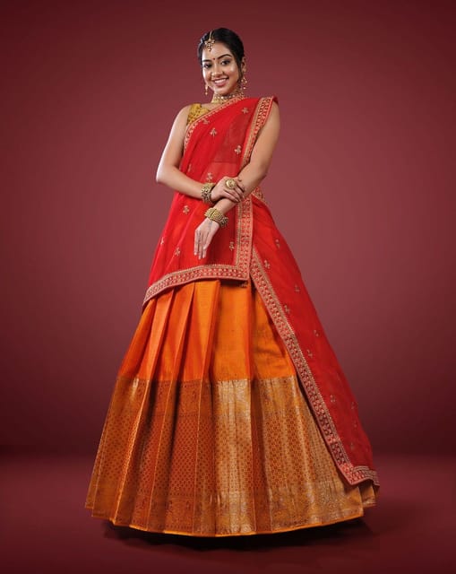 Red embroidered lehenga and golden blouse and dupatta available only at IBFW
