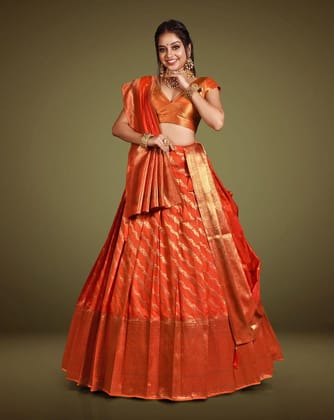 Orange Embelished Banarasi Silk Lehenga With Intricate Zari Work, Unstitched Blouse, And Matching Dupatta.