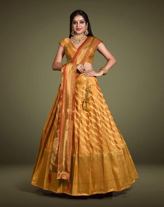 Gold And Red Embelished Banarasi Silk Lehenga With Intricate Zari Work, Unstitched Blouse, And Matching Dupatta.