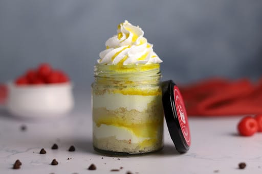 Sweet Homemade Mango Dessert, Cheesecake, Trifle, Mouse in a Glass Jar on a  Light Wooden Background, Vertical Composition Stock Photo - Image of  custard, homemade: 145868834