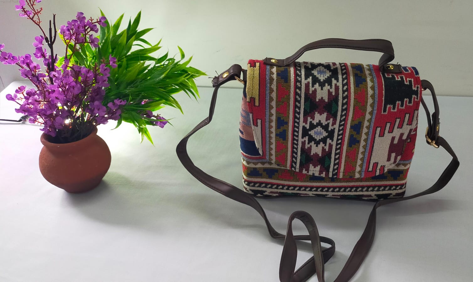 TVM08- Vibrant Spectrum: White Jacquard Cloth and Leather Sling Bag