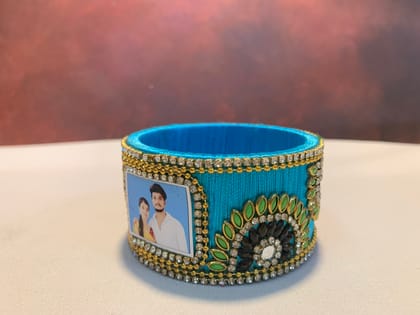 NVSB024- Sky blue with green and black stone silk thread bangle