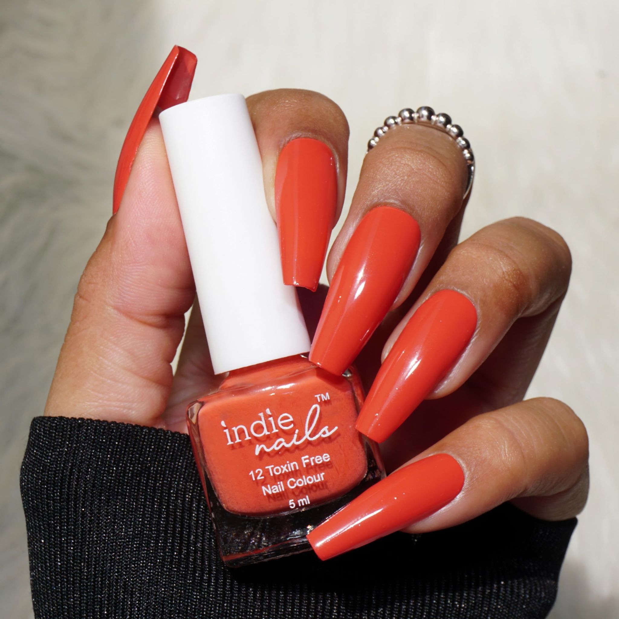 Indie Nails Sunset Orange is Free of 12 toxins vegan cruelty-free quick dry glossy finish chip resistant. Nude Orange Colour shade Nail polish: 5 ml