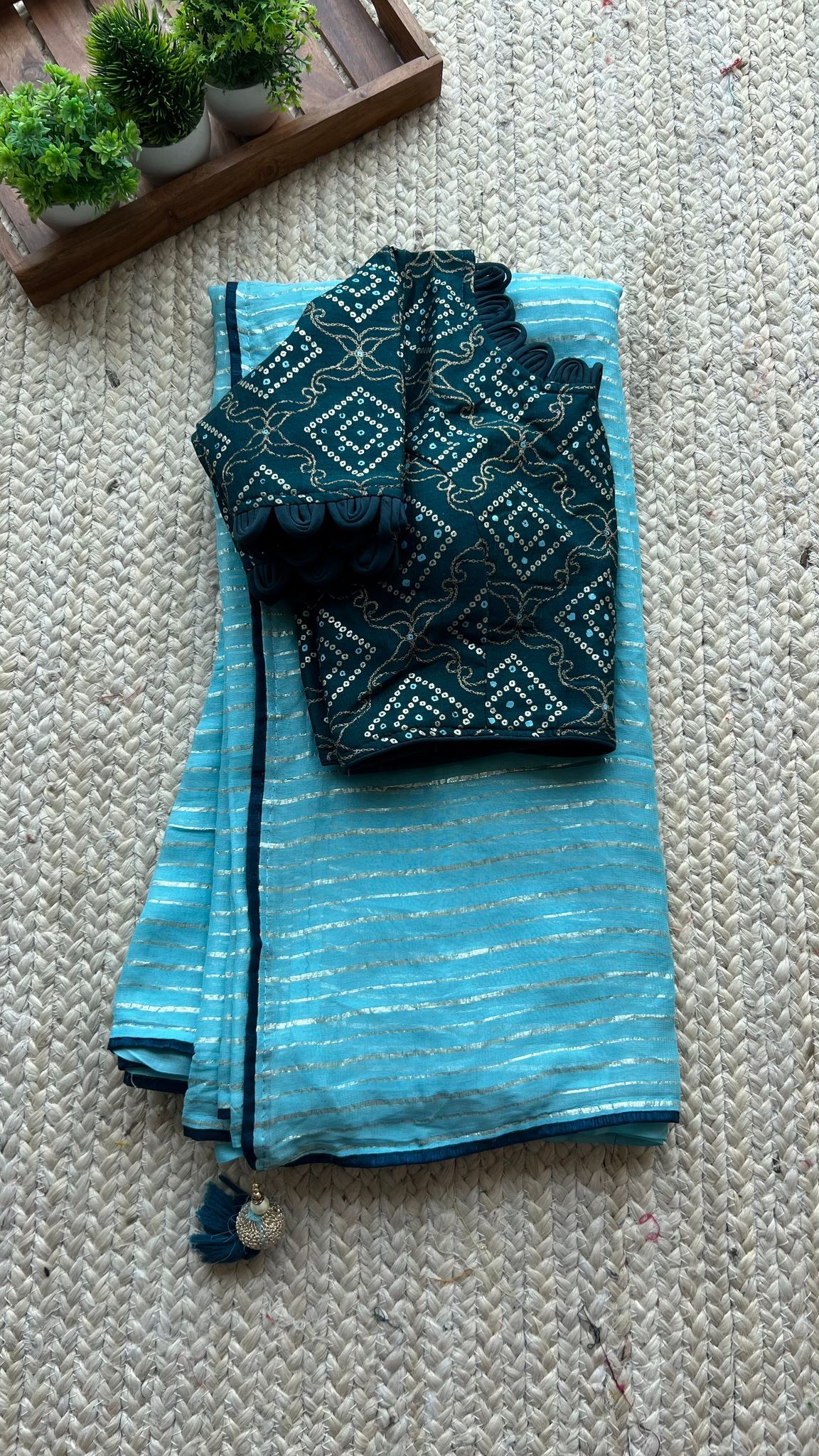 Blue chiffon saree with blue silk handwork blouse