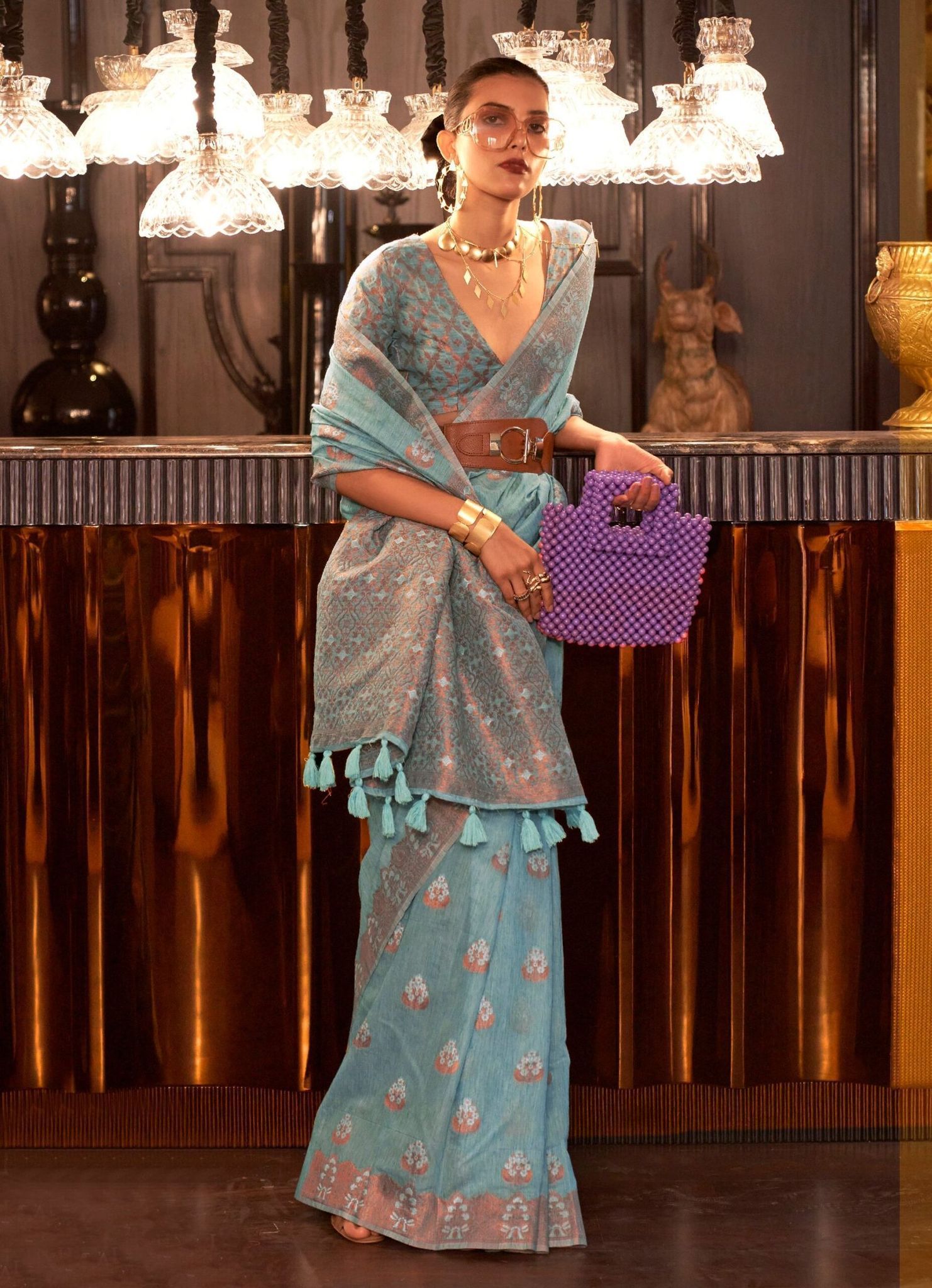 Turquoise Color Linen Fabric Copper Zari Woven Saree With Border Tassal Pallu And Fancy Blouse Piece