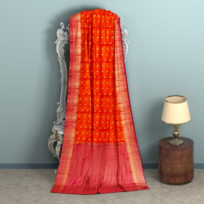 Orange body with red border1000 buttas semi silk saree