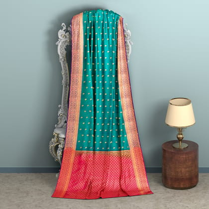 Greenish blue body with pink border 1000 buttas semi silk saree