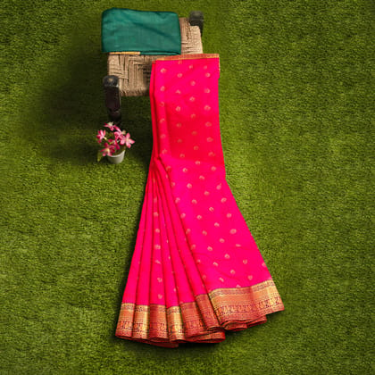 Ruby pink body with zari worked border 1000 buttas semi silk saree.