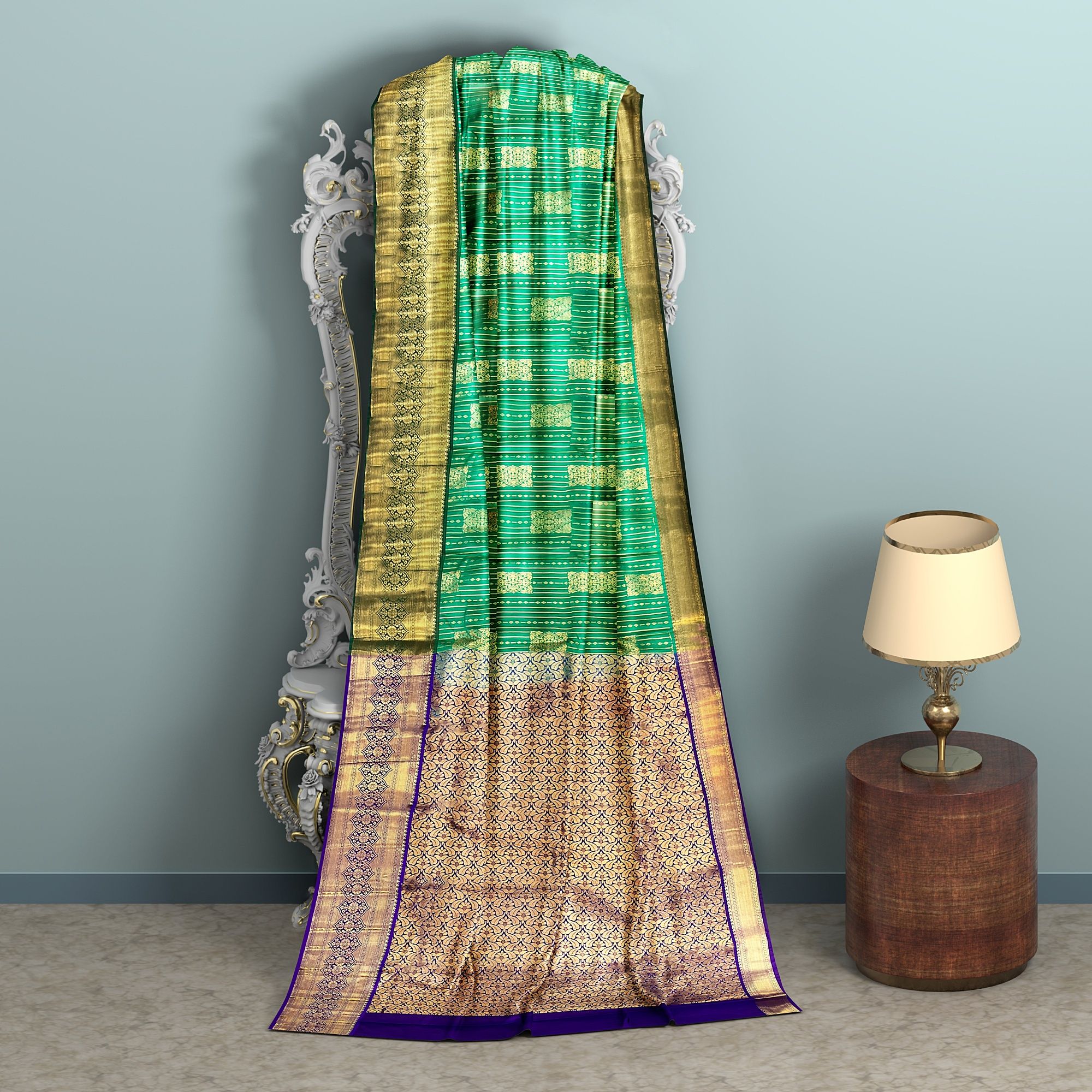 Dark green body with zari worked border and pallu.