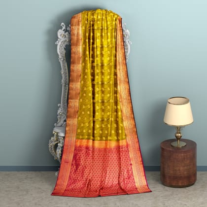 Mustard body with zari worked red border 1000 buttas semi silk saree