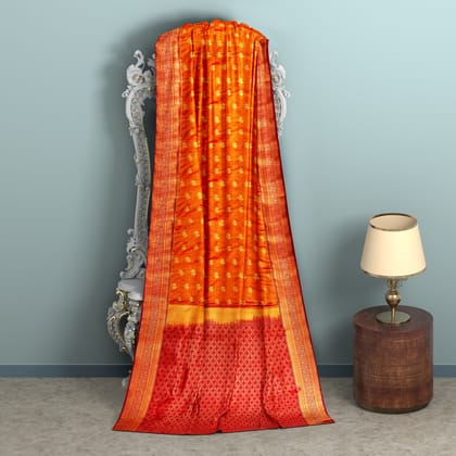 pumpkin orange body with zari worked red border 1000 buttas semi silk saree