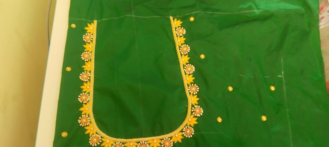  Green blouse with intricate embroidery