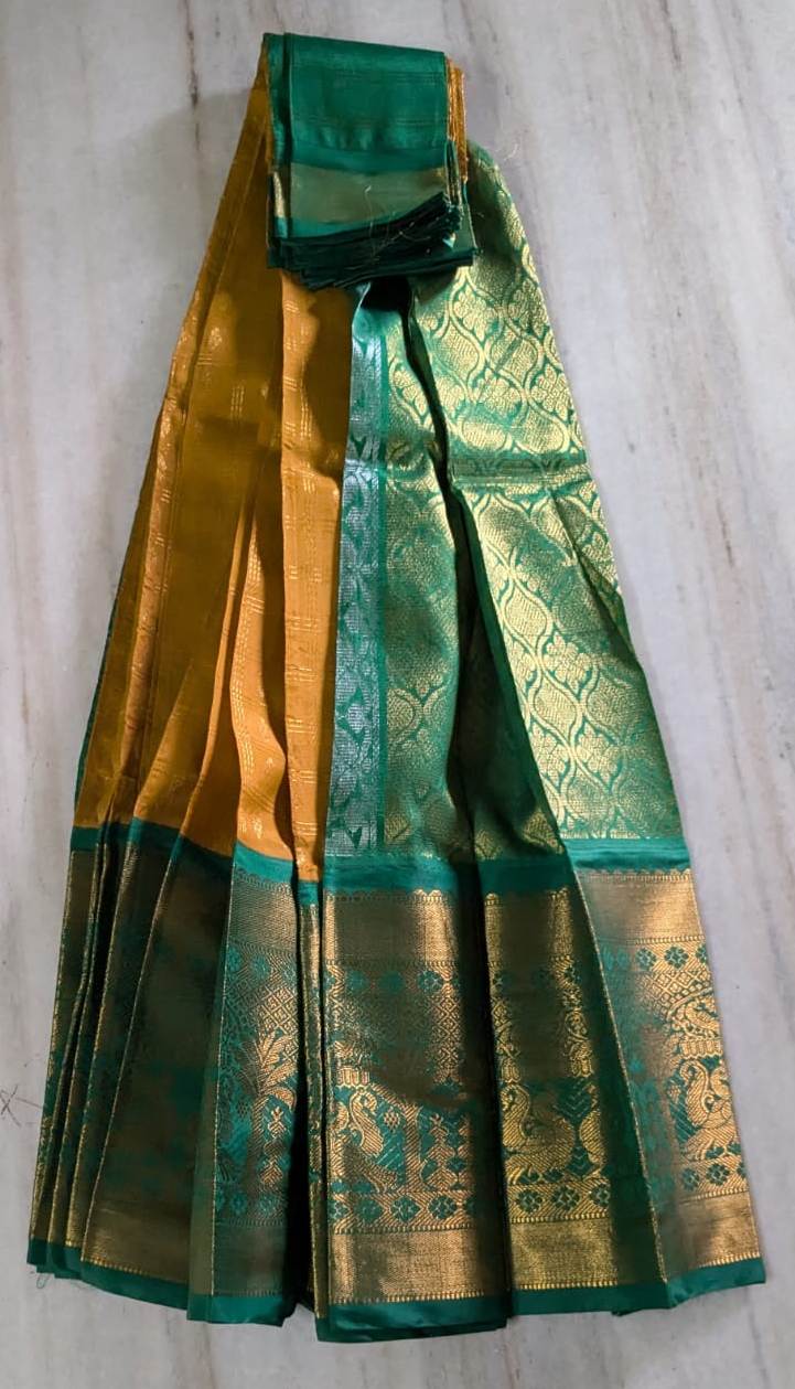  Green and gold silk traditional Indian sari with intricate zari work