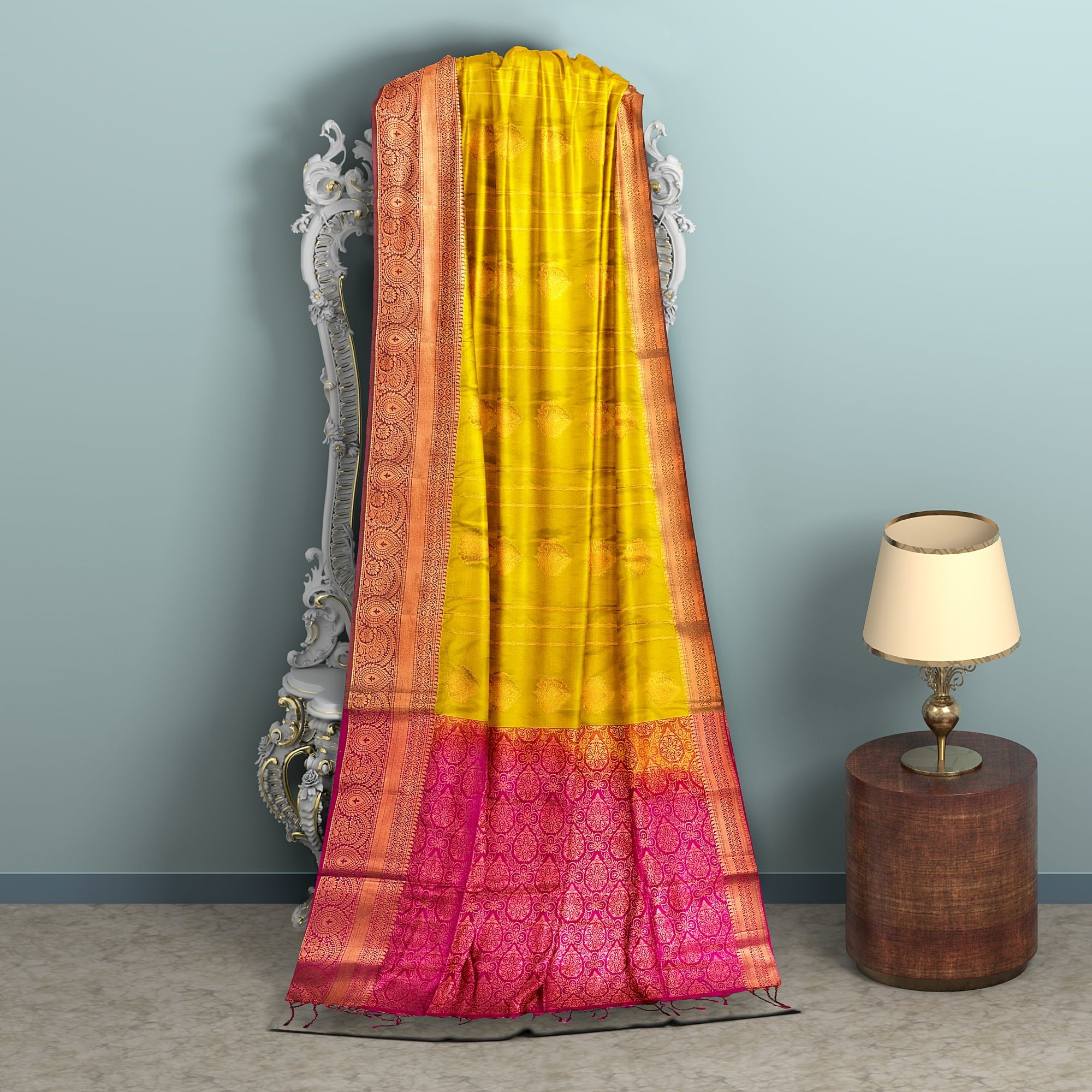 saffron Yellow with Pink pallu semi Silk Saree has floral buttas