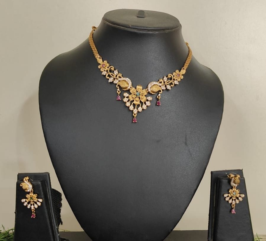  Gold-plated traditional Indian choker necklace set with floral motifs and rubies