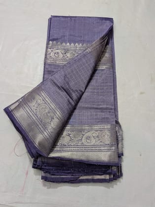  A beautiful, traditional Indian silk saree in a deep blue color with silver zari work.