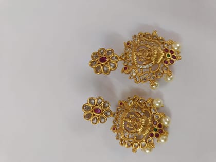 "Stunning antique gold plated traditional Indian earrings with intricate detailing and pearl drops."