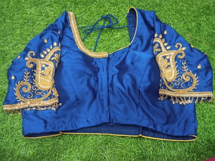  Blue blouse with intricate golden embroidery and mirror work