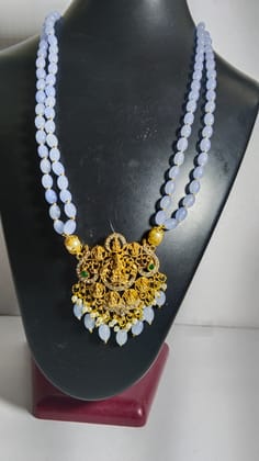  "Stunning and elegant pearl necklace with intricate gold pendant"