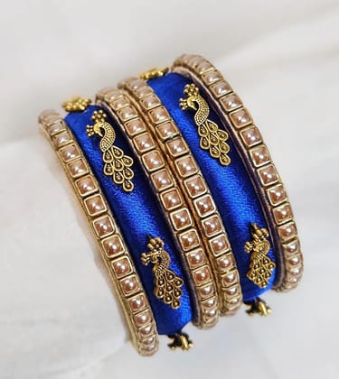  Set of 6 Blue Silk Thread Bangles with Golden Peacock Design and Pearl Beads