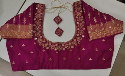 Embroidered magenta silk designer blouse with mirror work and zari border