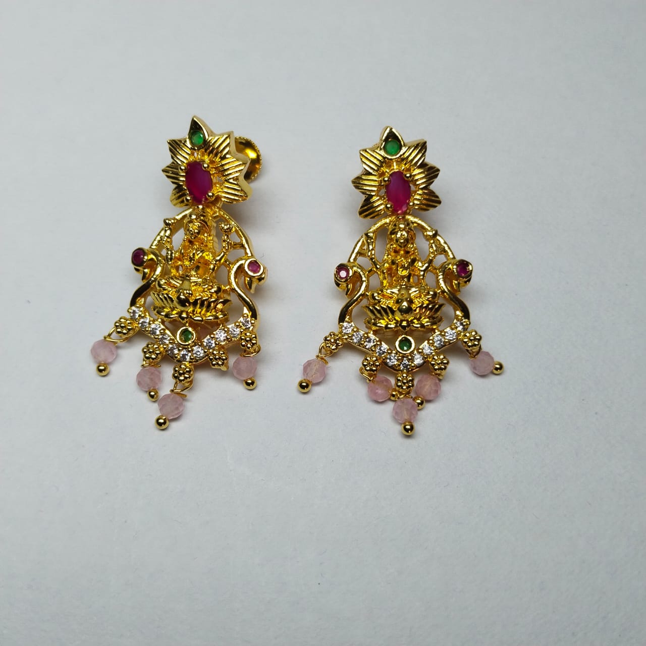 Gold Goddess Lakshmi Hanging Jhumka Earrings With Ruby and White Stones