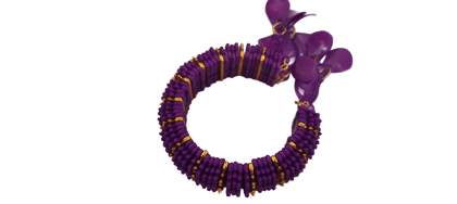 Gold and purple beaded bracelet with unique design