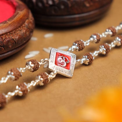 Silver Rakhi with Rudraksha and Om, Red-Colored Double Line Design