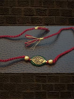 Antique tukdi with green pirohi maroon thread rakhi