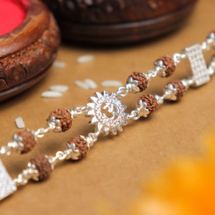 Silver Rakhi with Rudraksha, Om, and Sunface Double Line Design