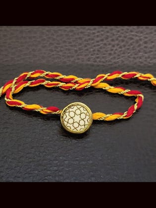 White round(1.5cm) thewa rakhi in mauli thread