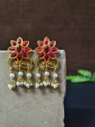 Golden Party Wear Stud Earrings with Pearl Drops & Stone Work | Sarichka-Magenta