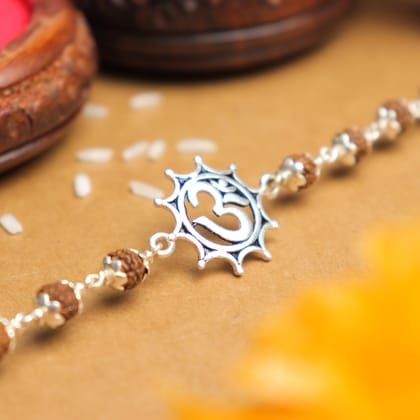 Silver Rakhi with Om in Pointed Circle and Single Line Rudraksha