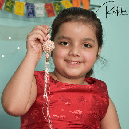 Handmade peach beaded rakhi