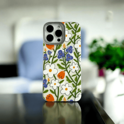 White Floral Case with Orange and Blue Accents-iPhone 15 Pro Max